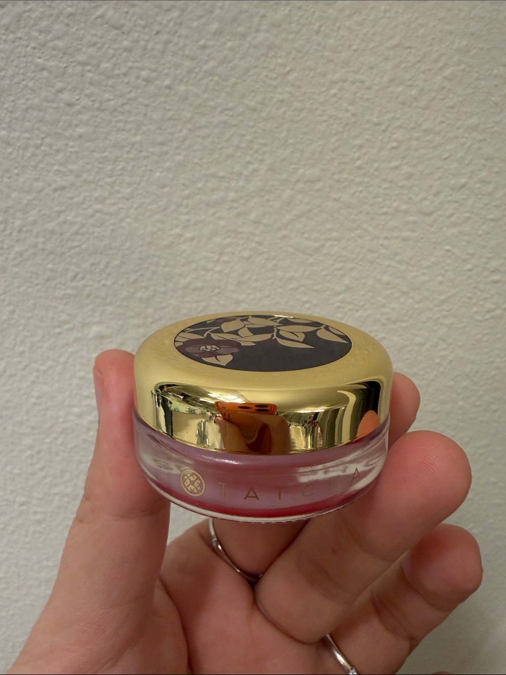 Tatcha Red Camellia lip balm, used
